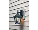 outdoor sconce mounted on side of house