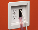 wires going into the wall through a combination power and low voltage electrical box