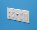 5 gang electrical box with variety of switches and outlets installed on wall