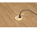 floor box in wooden floor with device plugged into receptacle