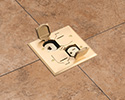 floor box in stone tiled floor with flip lids open
