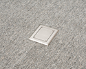 floor box in carpeted floor with blank cover