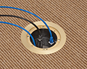 in-box recessed floor box with devices plugged in