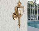 outdoor light fixture mounted to stucco wall