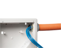 close up of bundle of low voltage cables entering TV box through ENT conduit